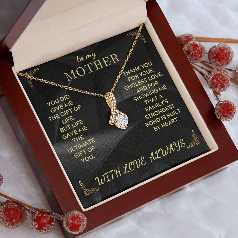 Gold-tone mother necklace with heart pendant in open red gift box