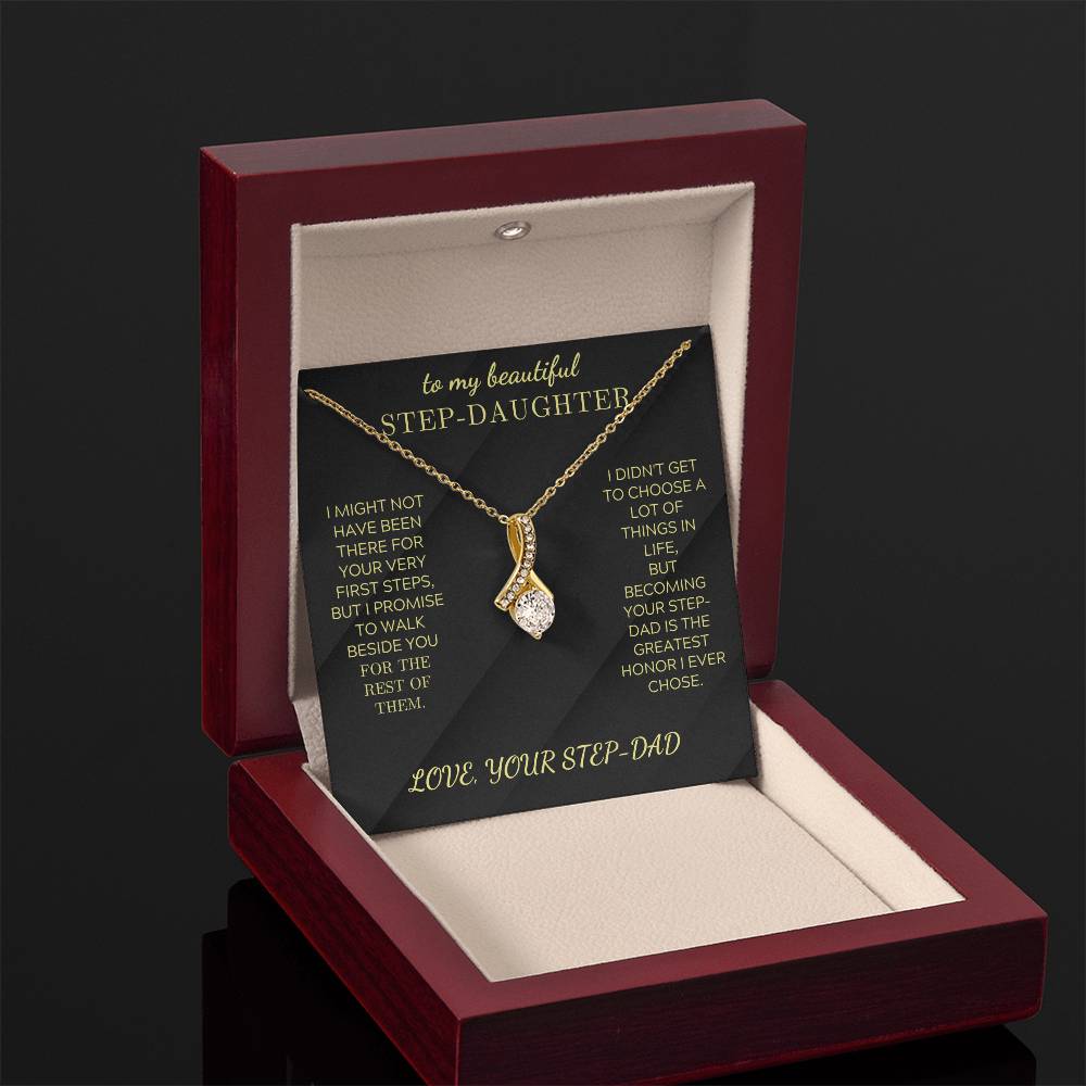 Gold-tone necklace with teardrop crystal charm in open gift box