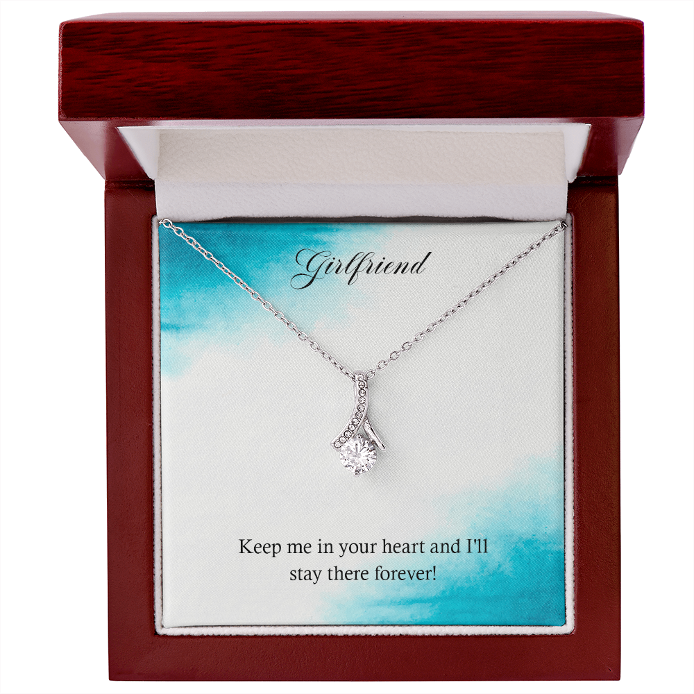 Silver-tone heart teardrop pendant necklace in a red wooden gift box.