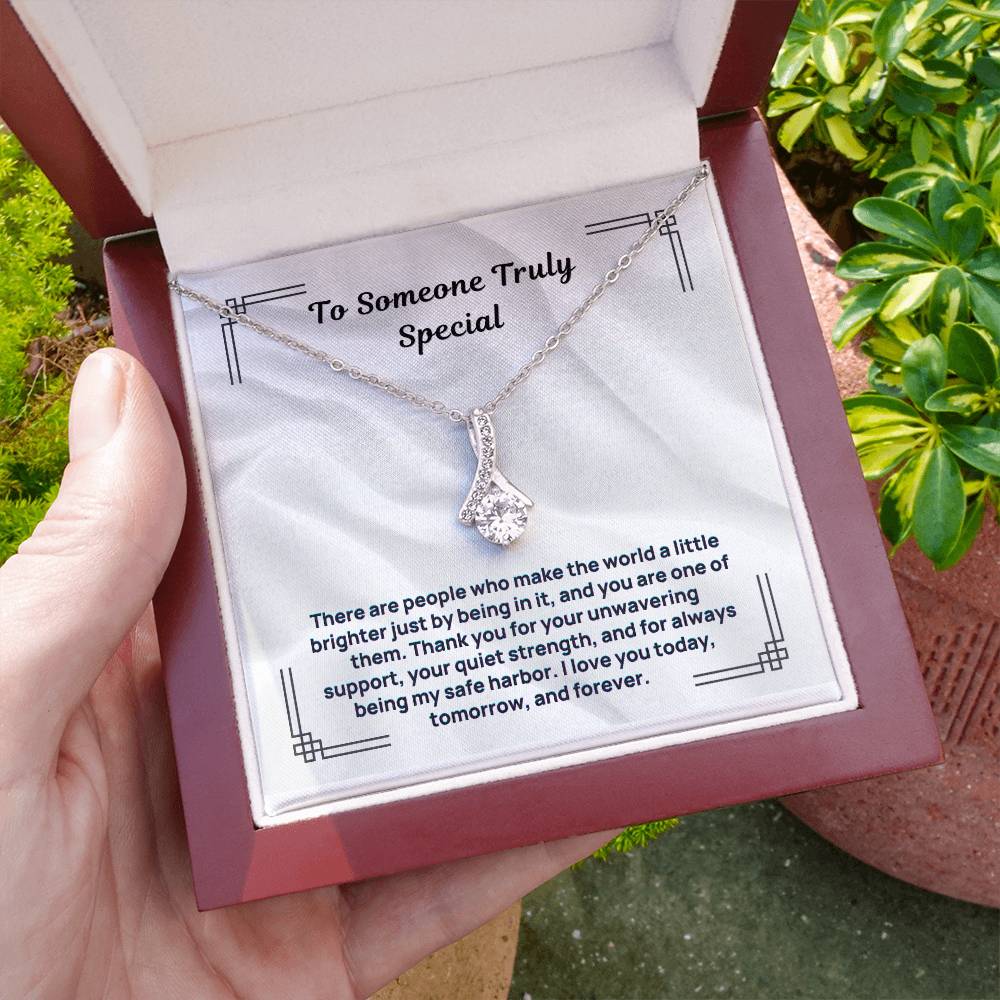 Silver-tone necklace with teardrop crystal pendant, in open gift box