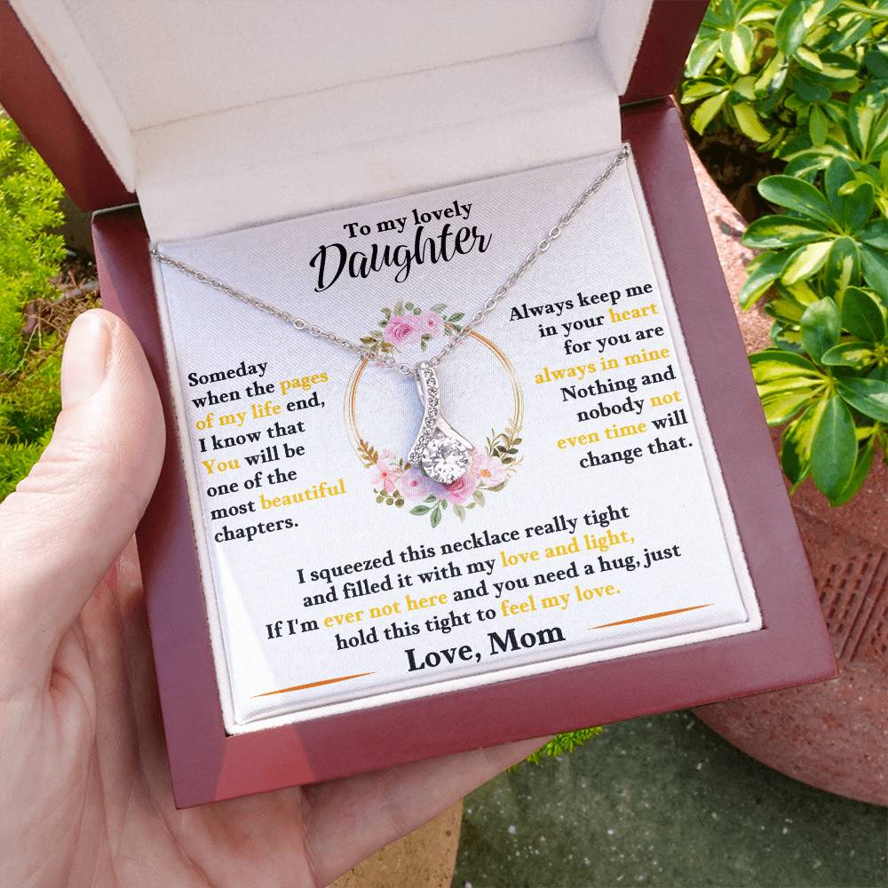 Daughter keepsake necklace with floral heart pendant and butterfly charm, in open gift box