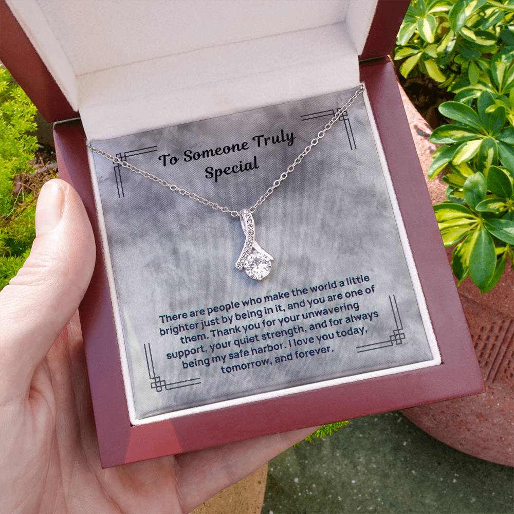Silver-tone teardrop crystal pendant necklace in an open gift box