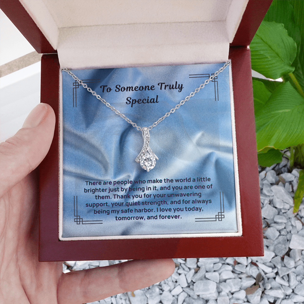 Silver teardrop pendant necklace with sparkling round center stone on chain