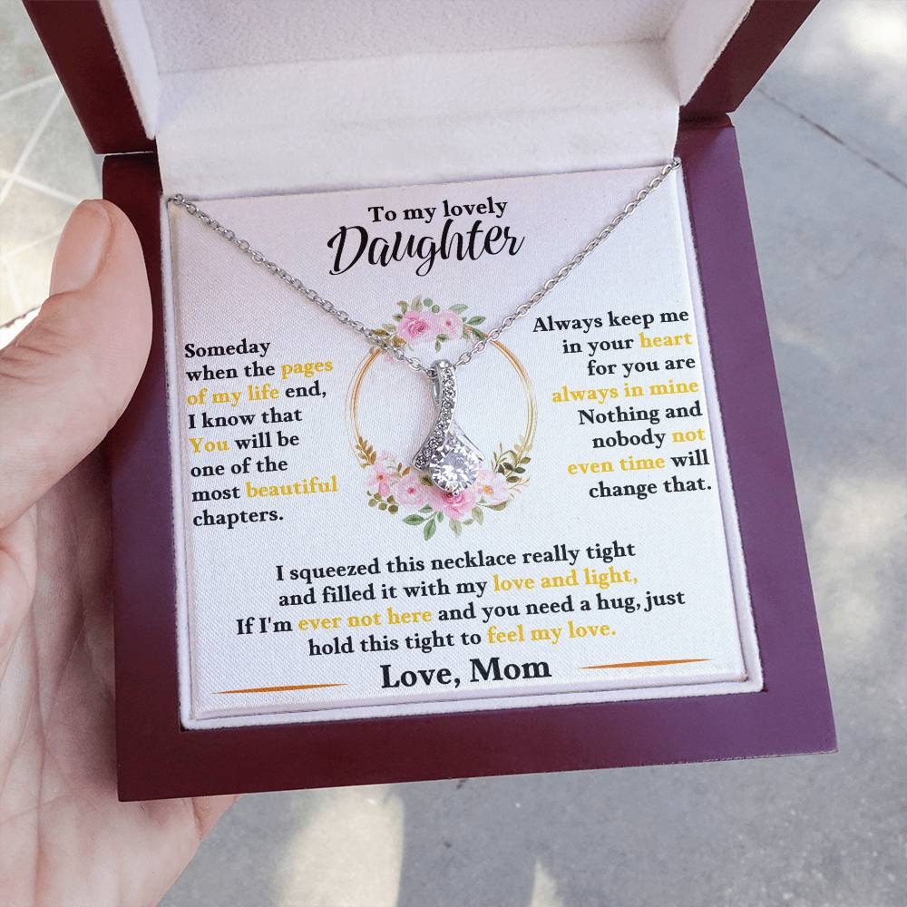 Keep-sake daughter necklace with butterfly charm and floral pendant, shown in gift box