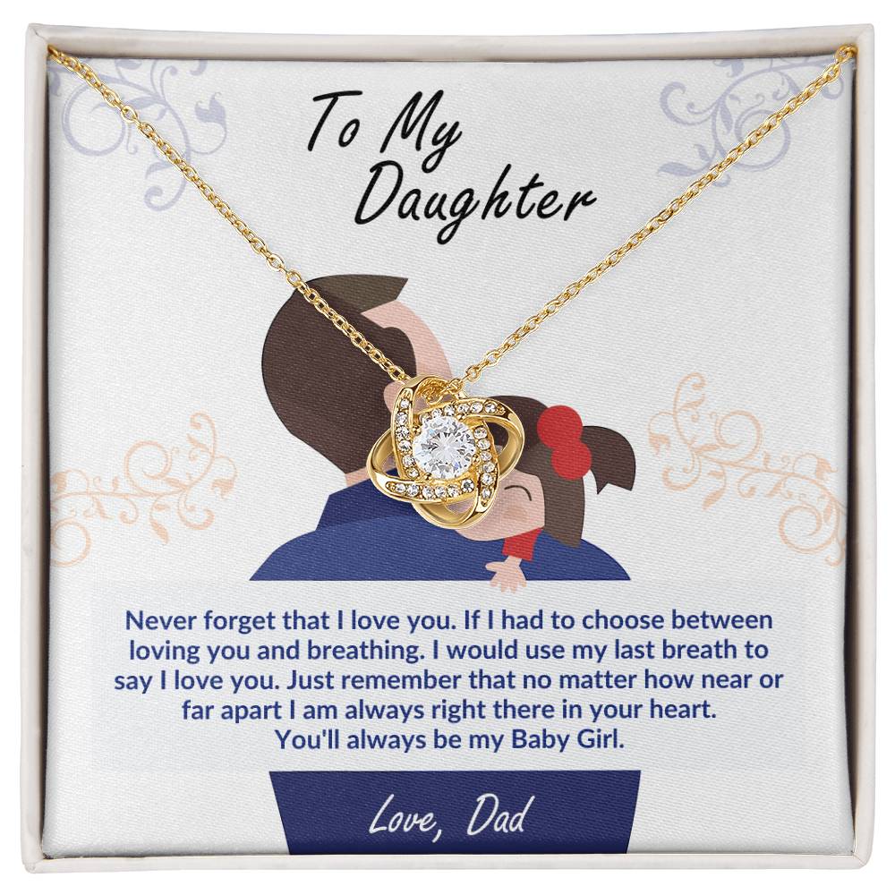 Gold heart pendant necklace with rosette charm, displayed in square gift box