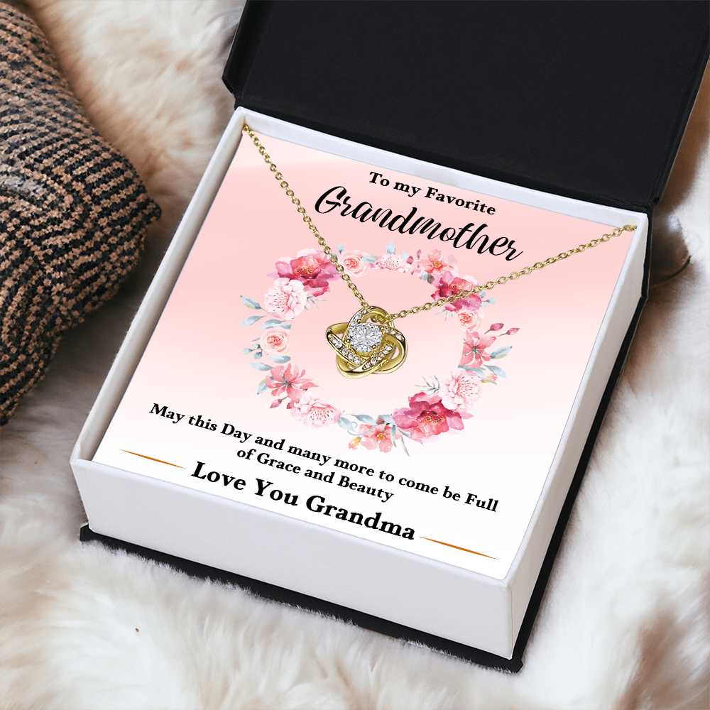 Gold love-knot pendant necklace in pink floral keepsake box with floral design