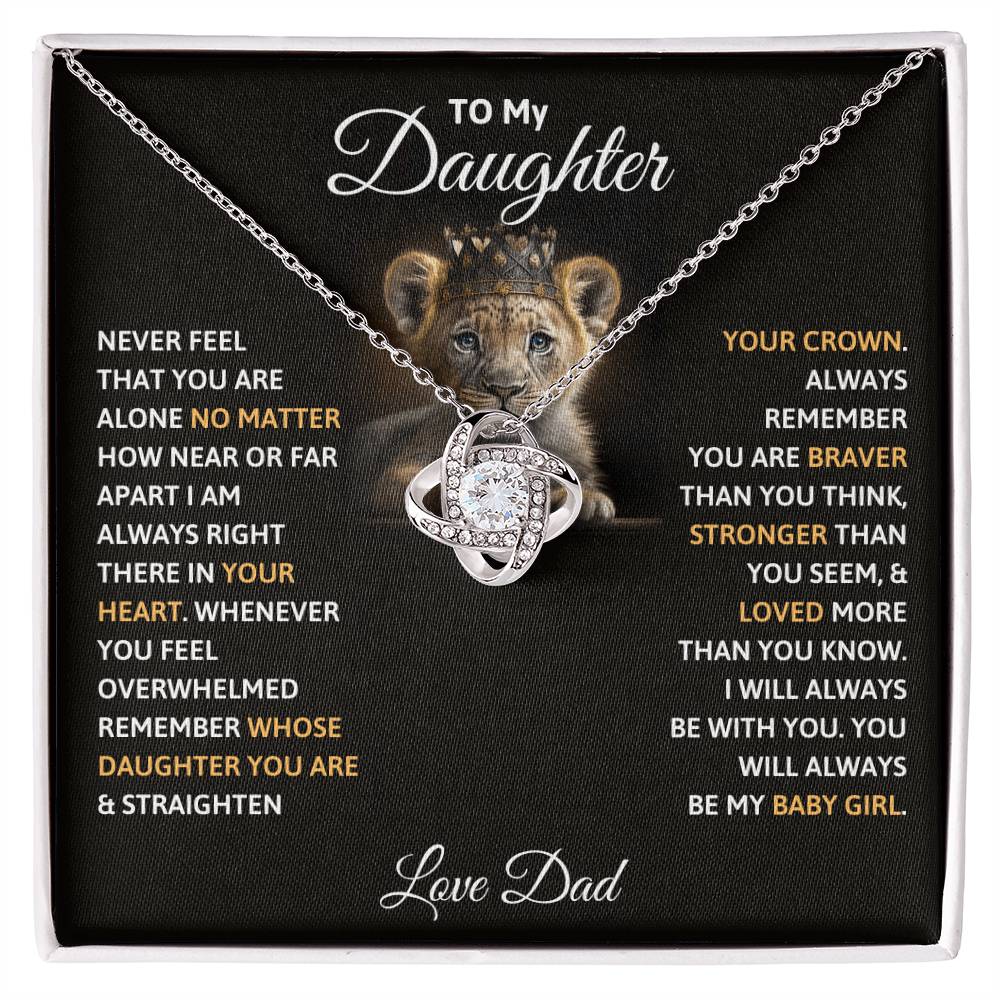 Silver-tone crown pendant necklace on black gift box insert with quote text