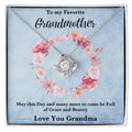 Silver-tone love knot heart pendant necklace with rhinestone details