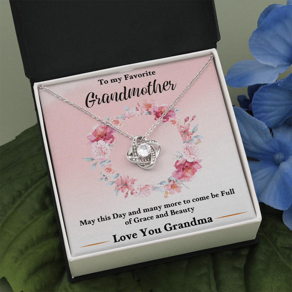 Silver love-knot pendant necklace in pink floral keepsake box, open view