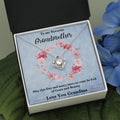 Silver-tone love knot heart pendant necklace shown on a blue gift card