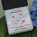 Silver-tone heart love knot necklace pendant with chain, displayed inside a gift box