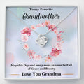 Silver heart knot pendant necklace with floral gift card backing