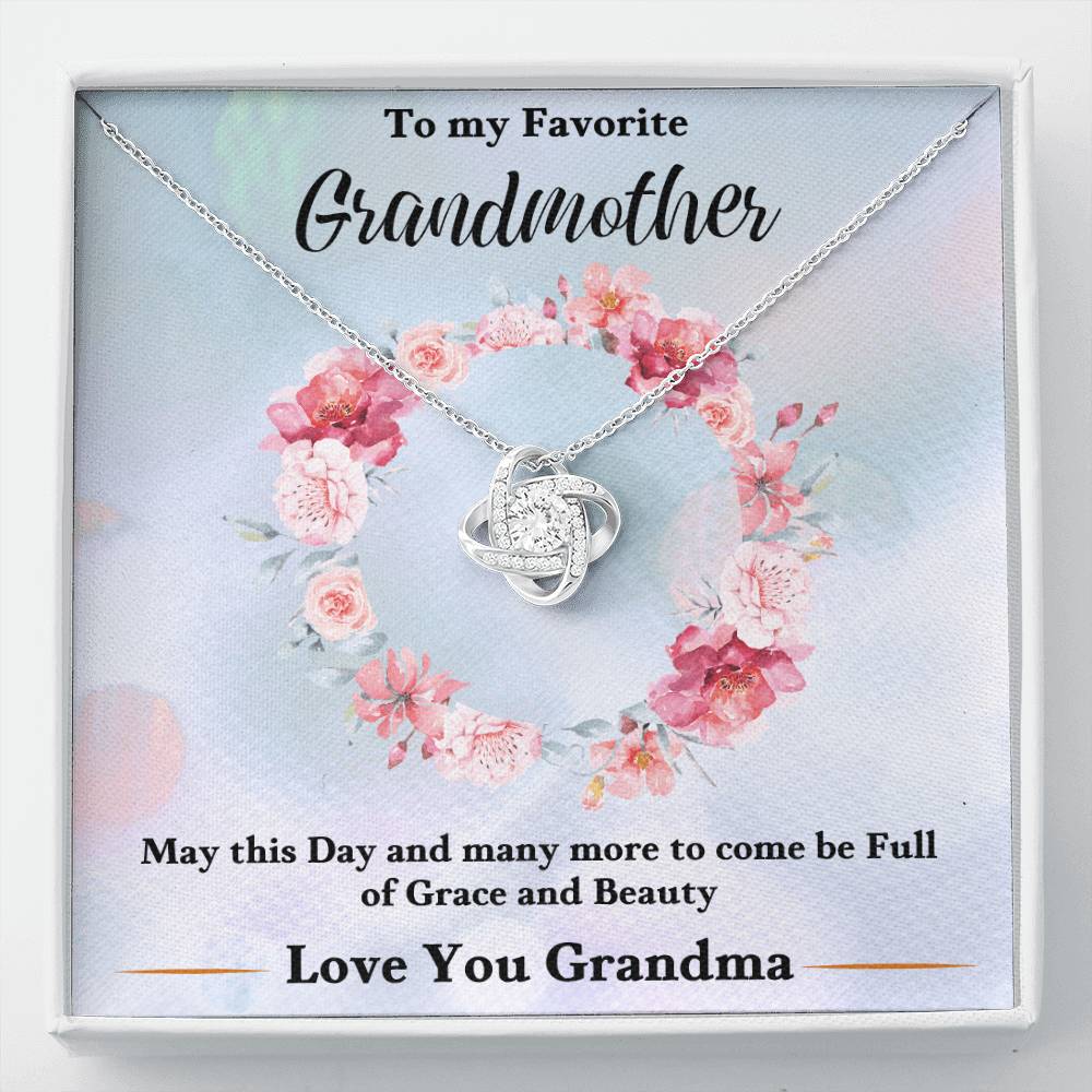 Silver heart knot pendant necklace with floral gift card backing