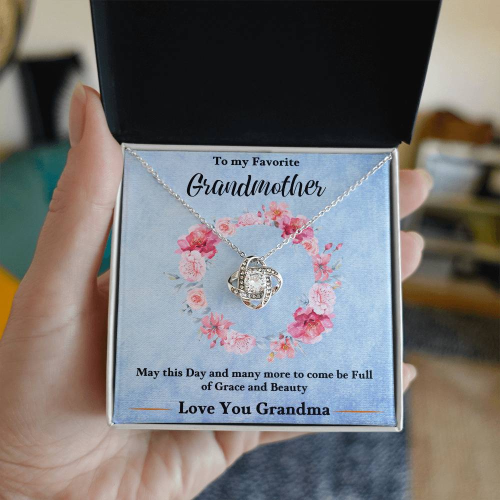 Silver-tone heart pendant love knot necklace in a blue gift box card