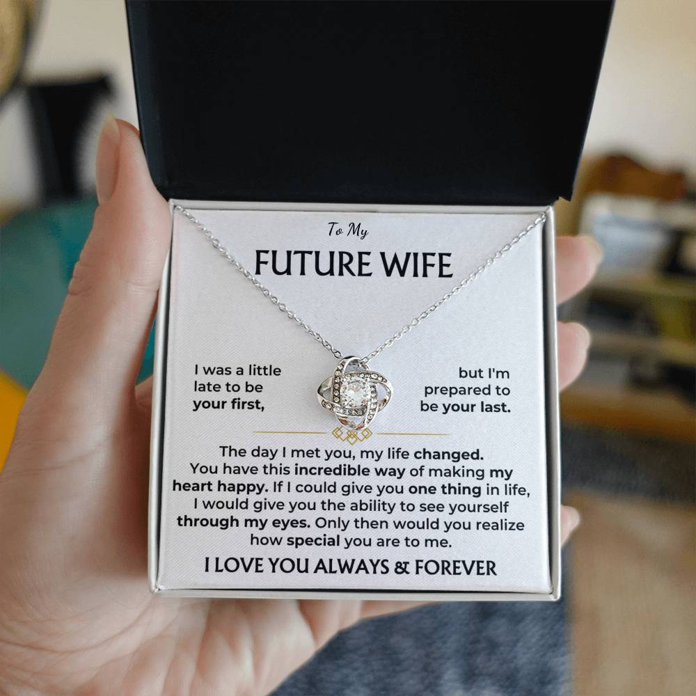 Silver-tone heart pendant necklace in “Future Wife” gift box, held in hand