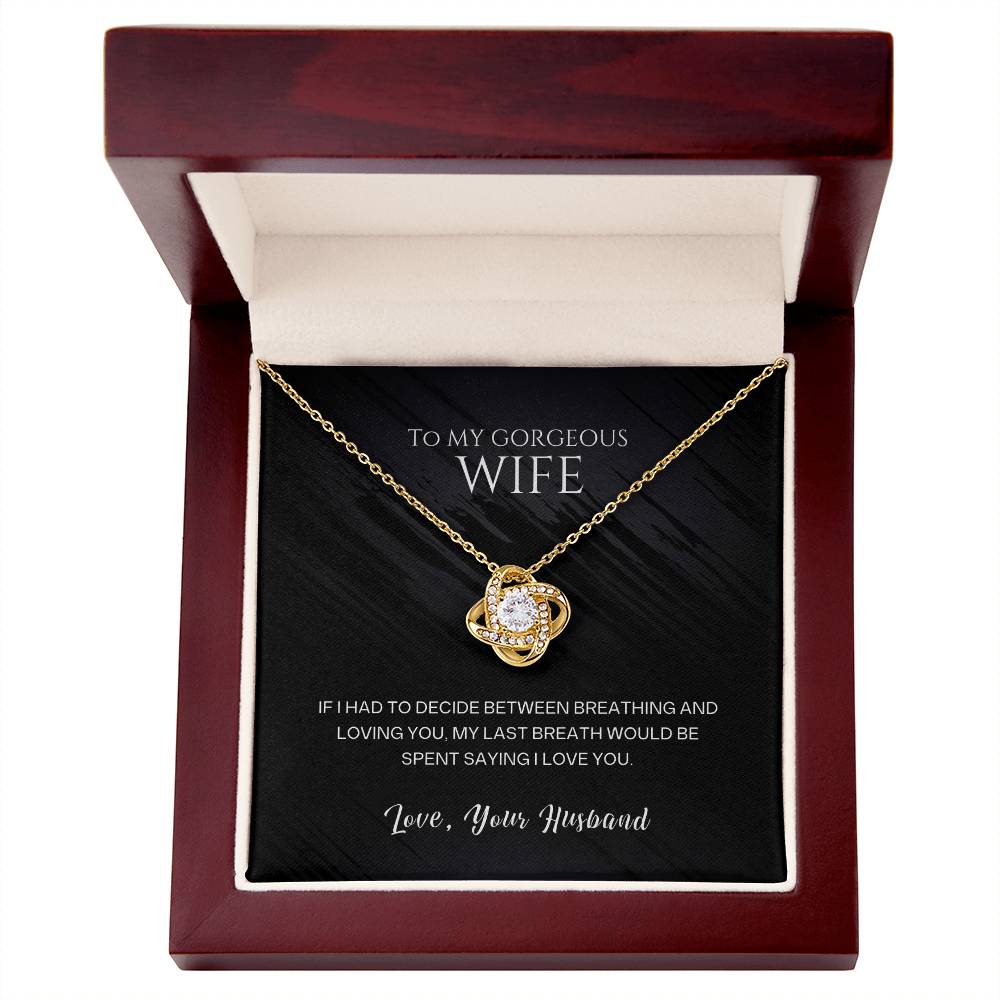 Gold-tone heart pendant necklace in a red gift box, chain on black insert