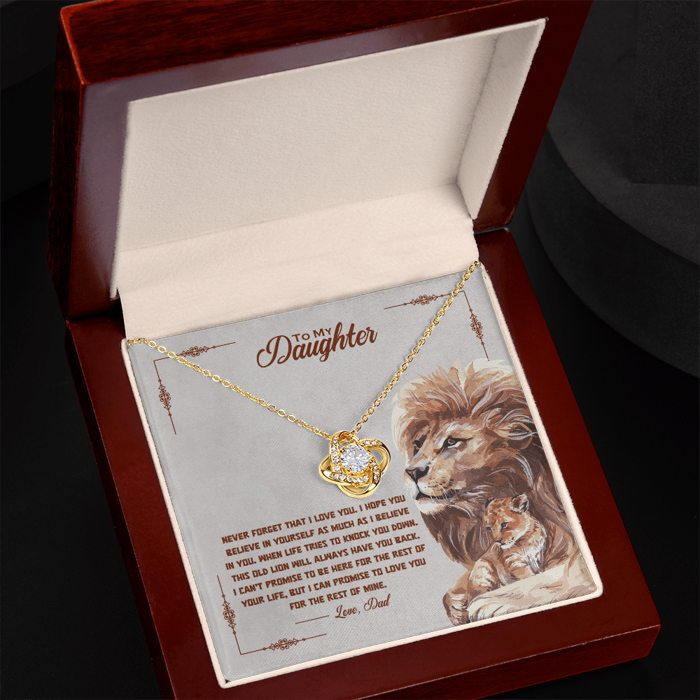 Gold-tone daughter promise necklace with round heart pendant, angled in gift box