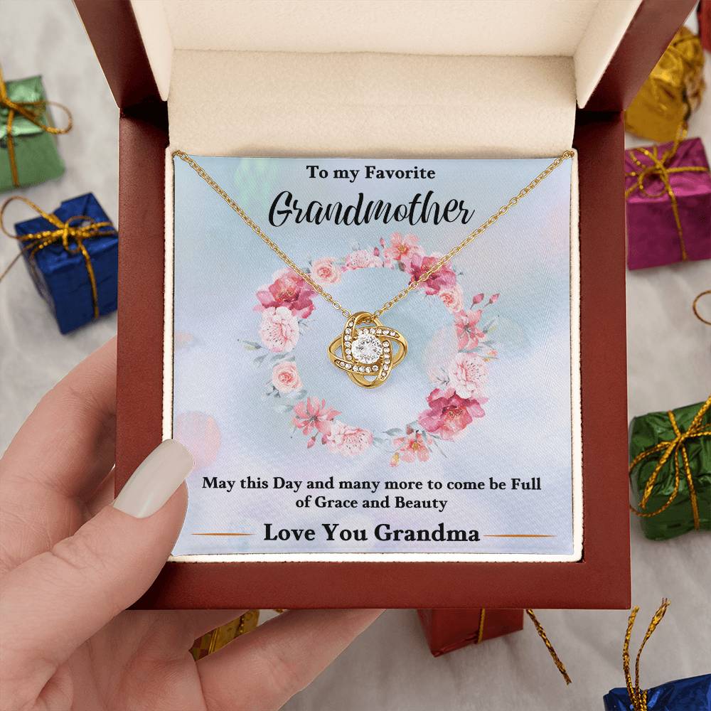 Gold-tone heart love knot necklace pendant with chain in a gift box with floral card