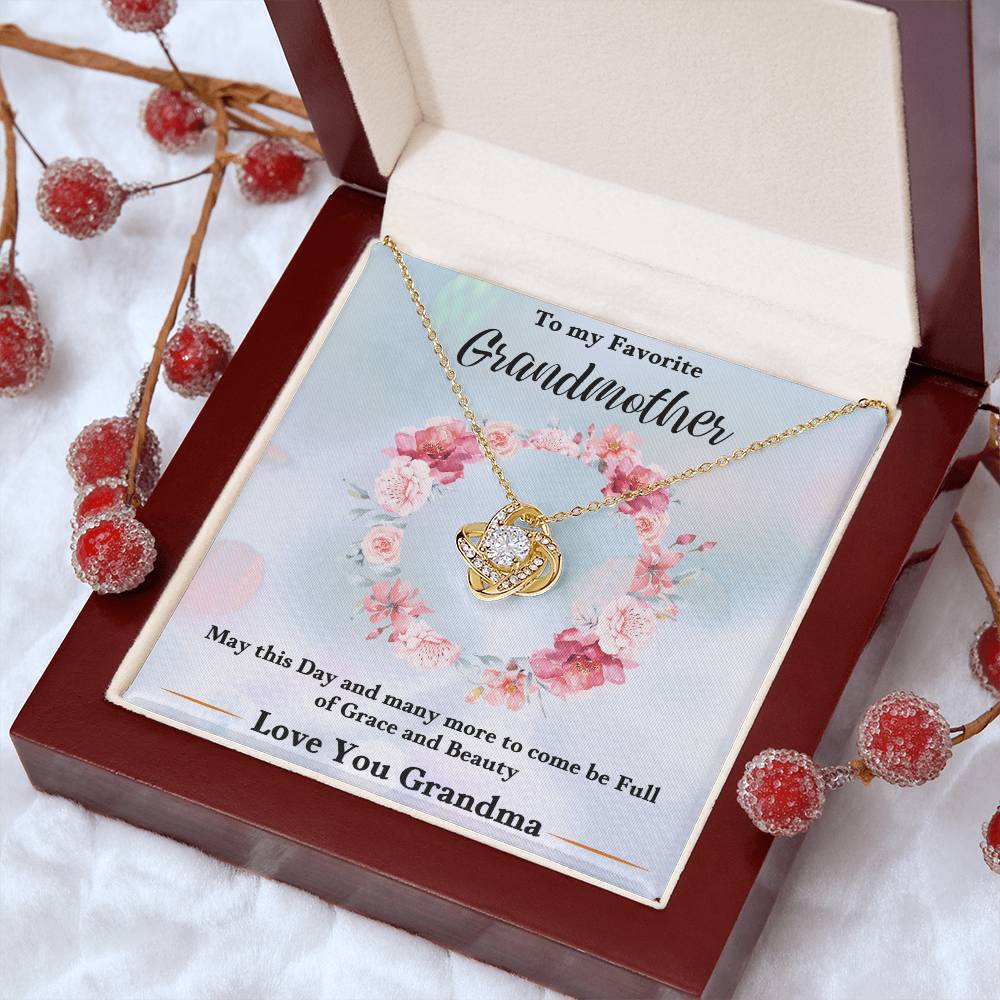 Gold-tone heart love knot necklace pendant with chain in gift box, floral wreath design