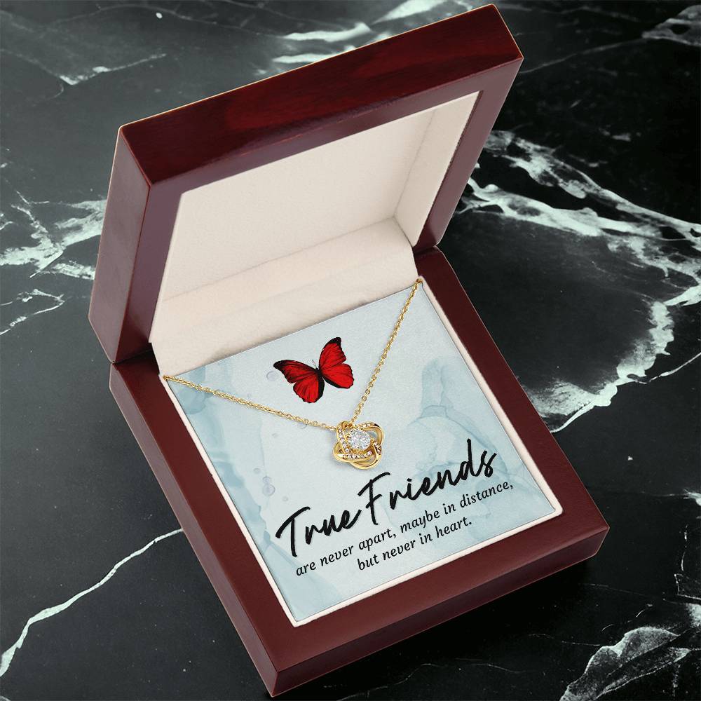 Friendship necklace in open red gift box, red butterfly charm and gold knot pendant