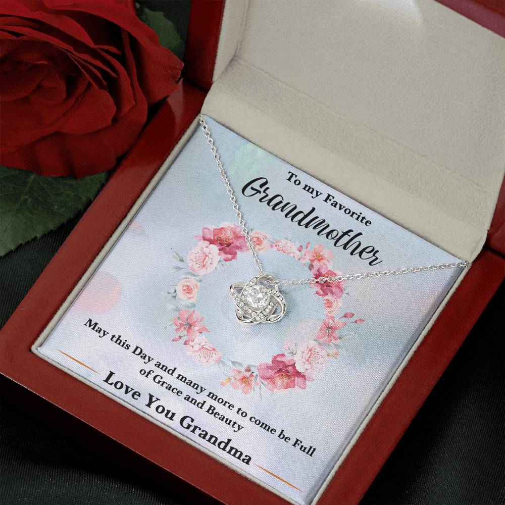 Silver-tone heart love knot necklace pendant with chain on floral gift card insert