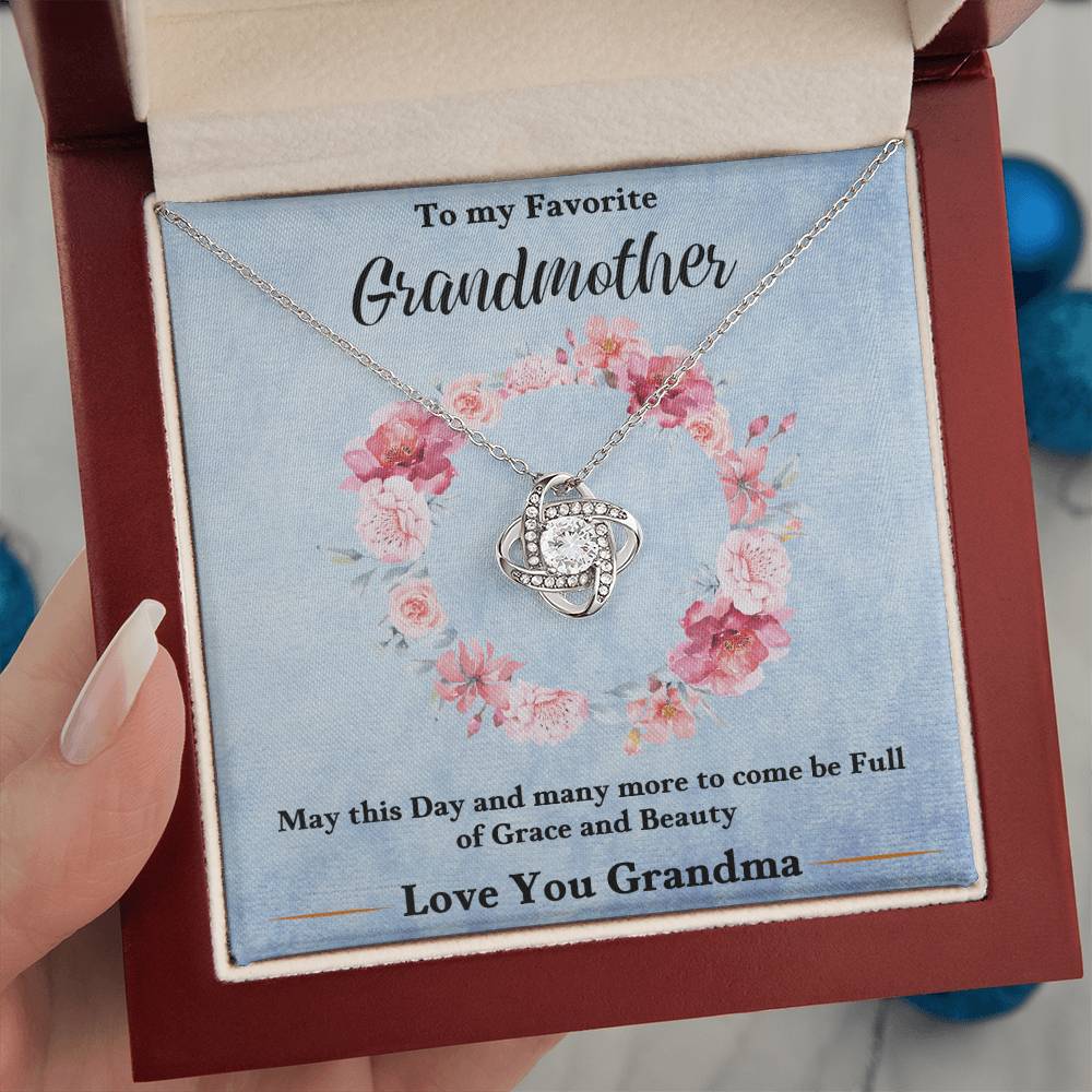 Silver-tone heart love knot pendant necklace with blue floral gift card