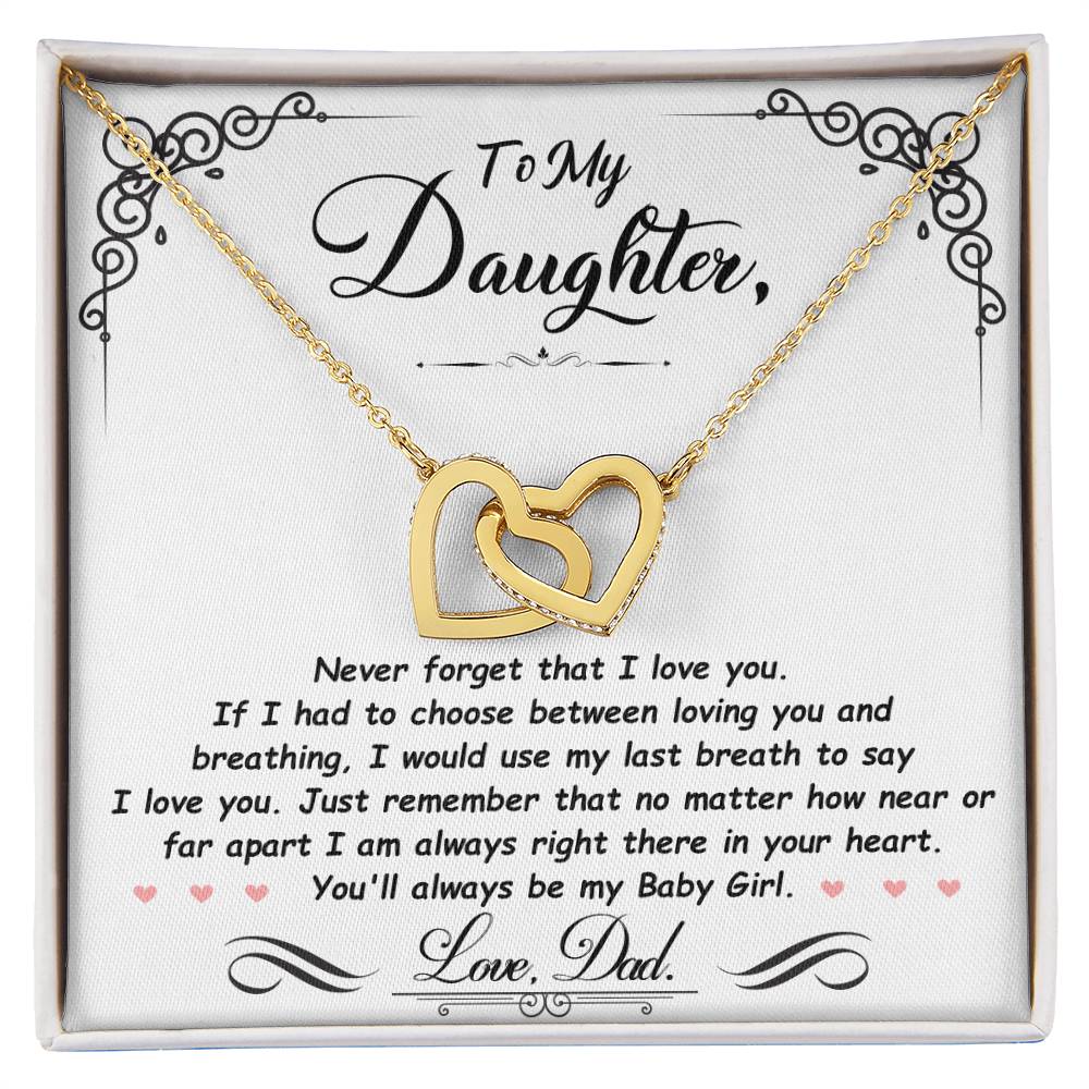 Gold-tone heart pendant necklace with two-tone heart charm in a white gift box