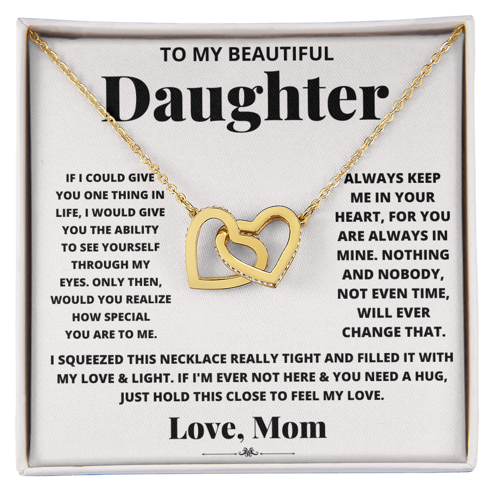 Daughter heart necklace in gold-tone with heart pendant inside a gift box.