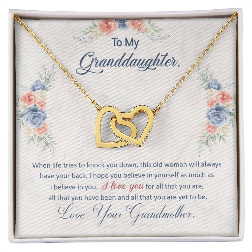 Gold heart pendant necklace in a floral gift box with printed message for granddaughter