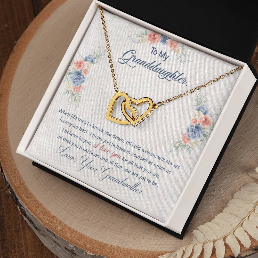 Heart pendant necklace displayed in a floral gift box with message for granddaughter