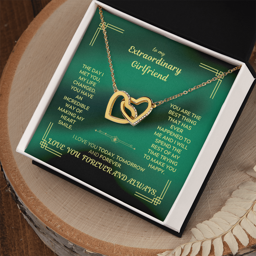 Heart interlocking necklace in gold- and silver-tone with chain links, in green gift box