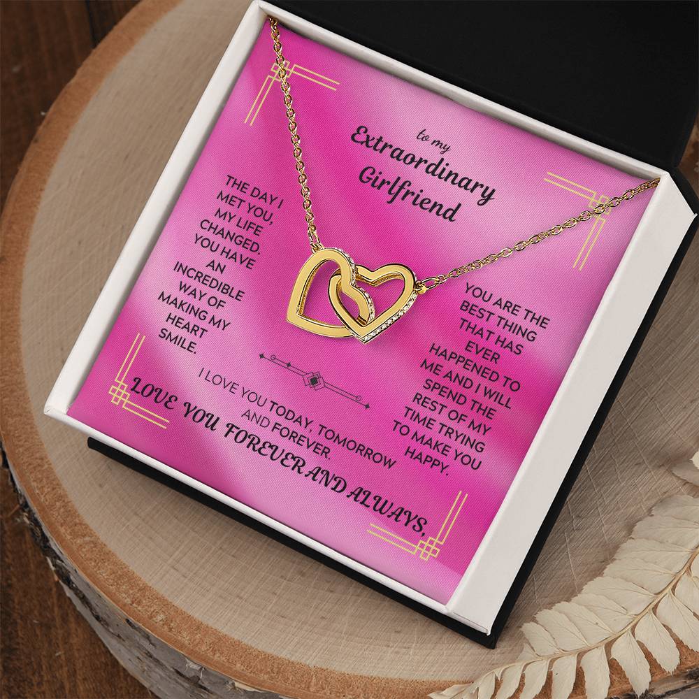 Rose-gold tone interlocking hearts pendant necklace on a gift card in a box