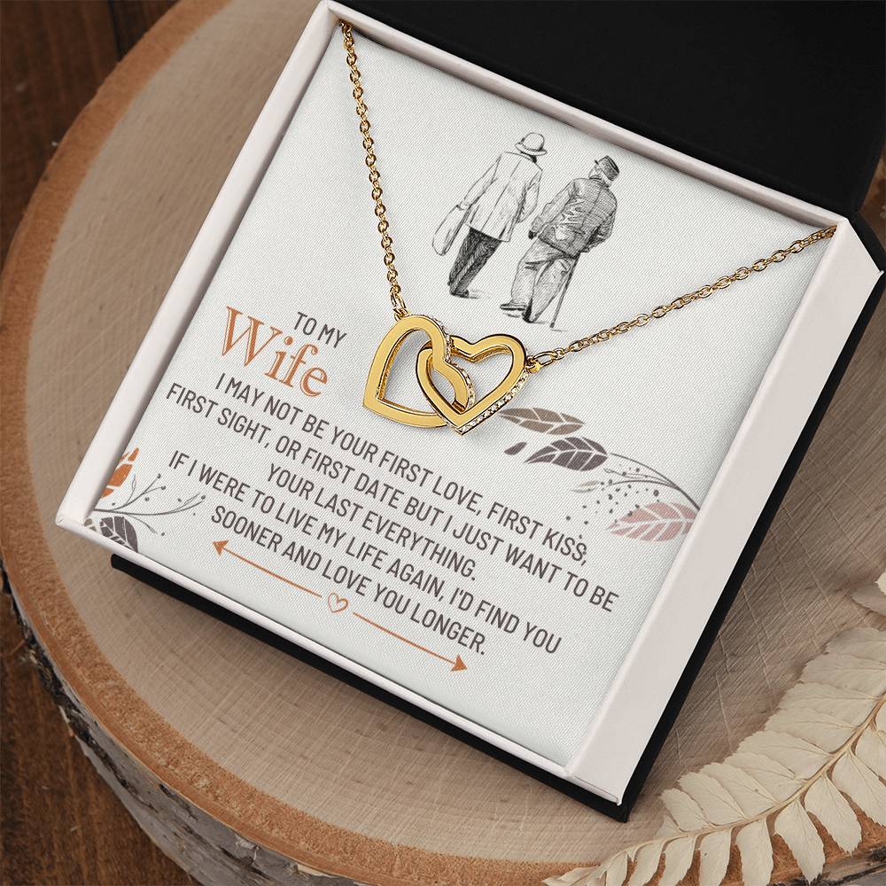 Gold-toned heart pendant necklace resting in an open gift box