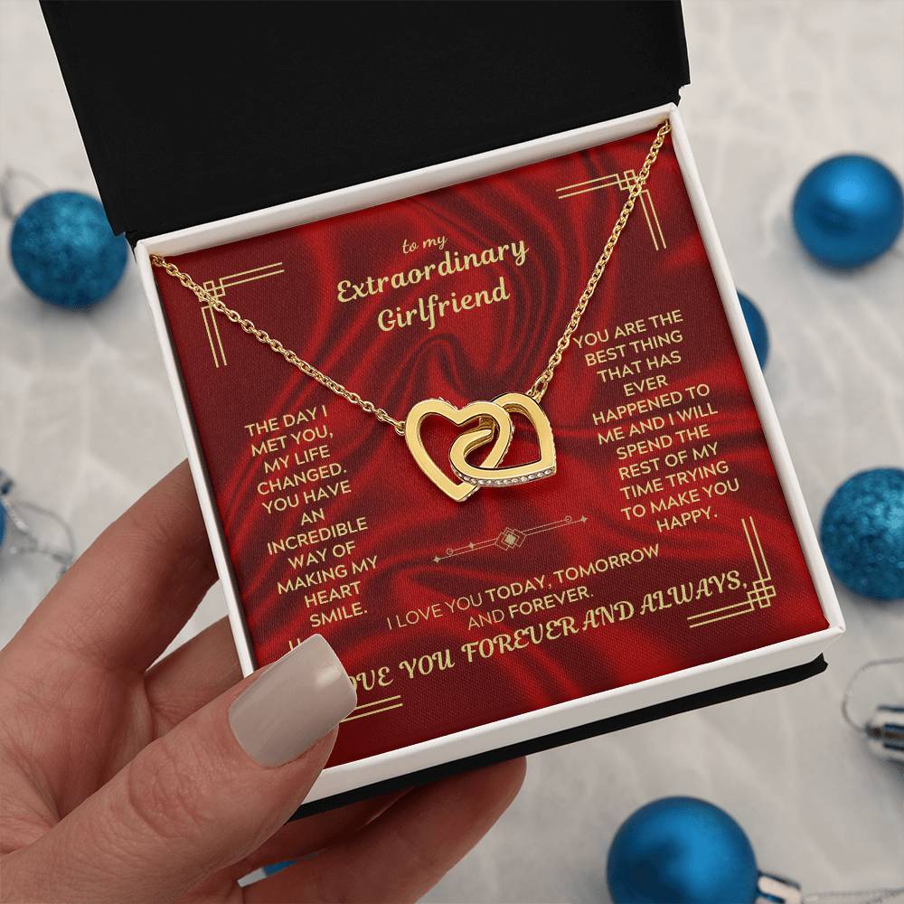 Gold interlocking heart necklace pendant on chain in red gift box