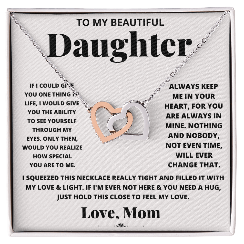 Daughter heart necklace in silver-tone with heart pendant inside a gift box.