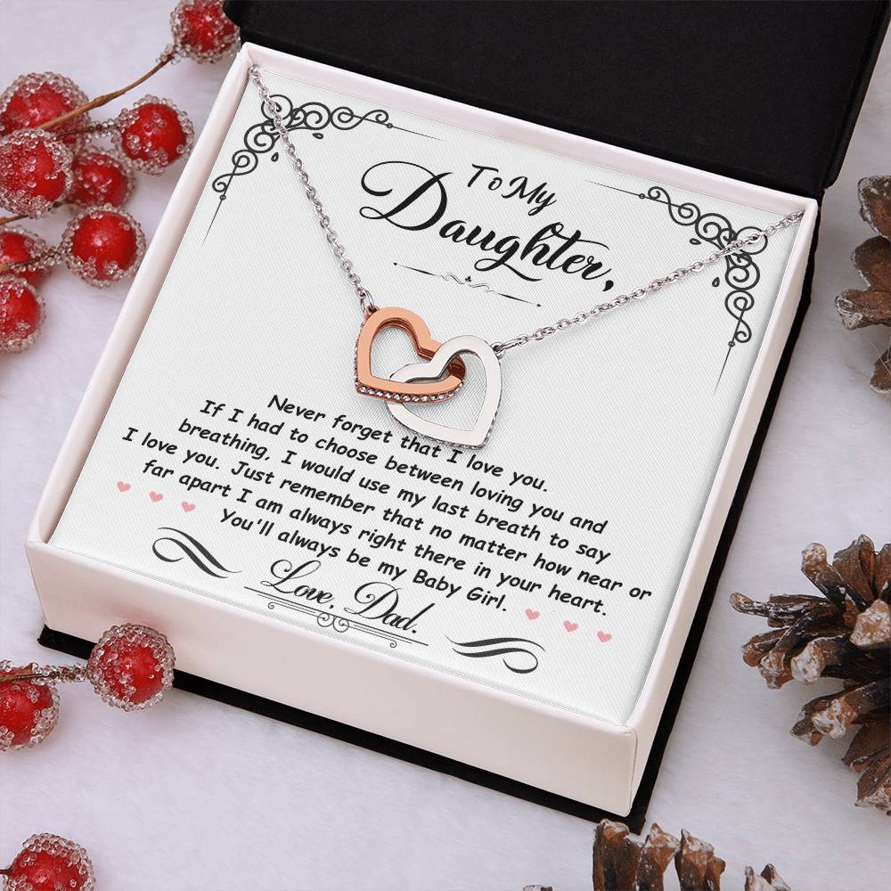 Silver-tone heart pendant necklace with two-tone heart charm in a white gift box