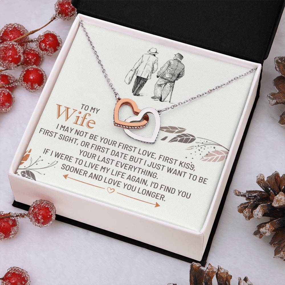 Heart pendant necklace on a gift box, silver-toned chain and dual-heart clasp