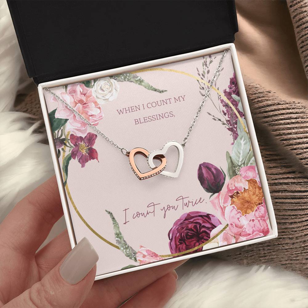 Heart pendant necklace with silver tone and rose-gold center in gift box