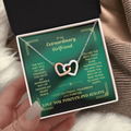 Two-heart interlocking necklace with rose-gold heart, silver heart, and delicate chain