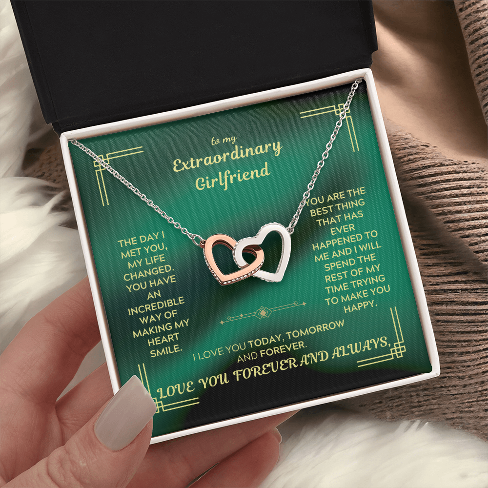 Two-heart interlocking necklace with rose-gold heart, silver heart, and delicate chain