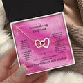 Rose-gold tone interlocking hearts pendant necklace with sparkle border
