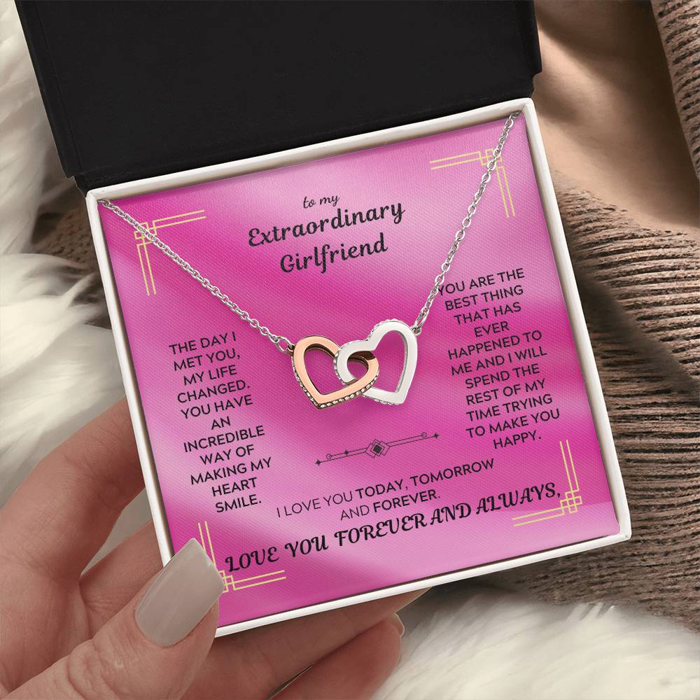 Rose-gold tone interlocking hearts pendant necklace with sparkle border