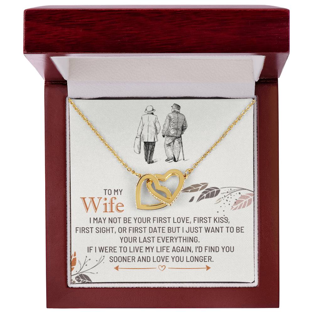 Gold-toned heart pendant necklace in a red box with a printed message card