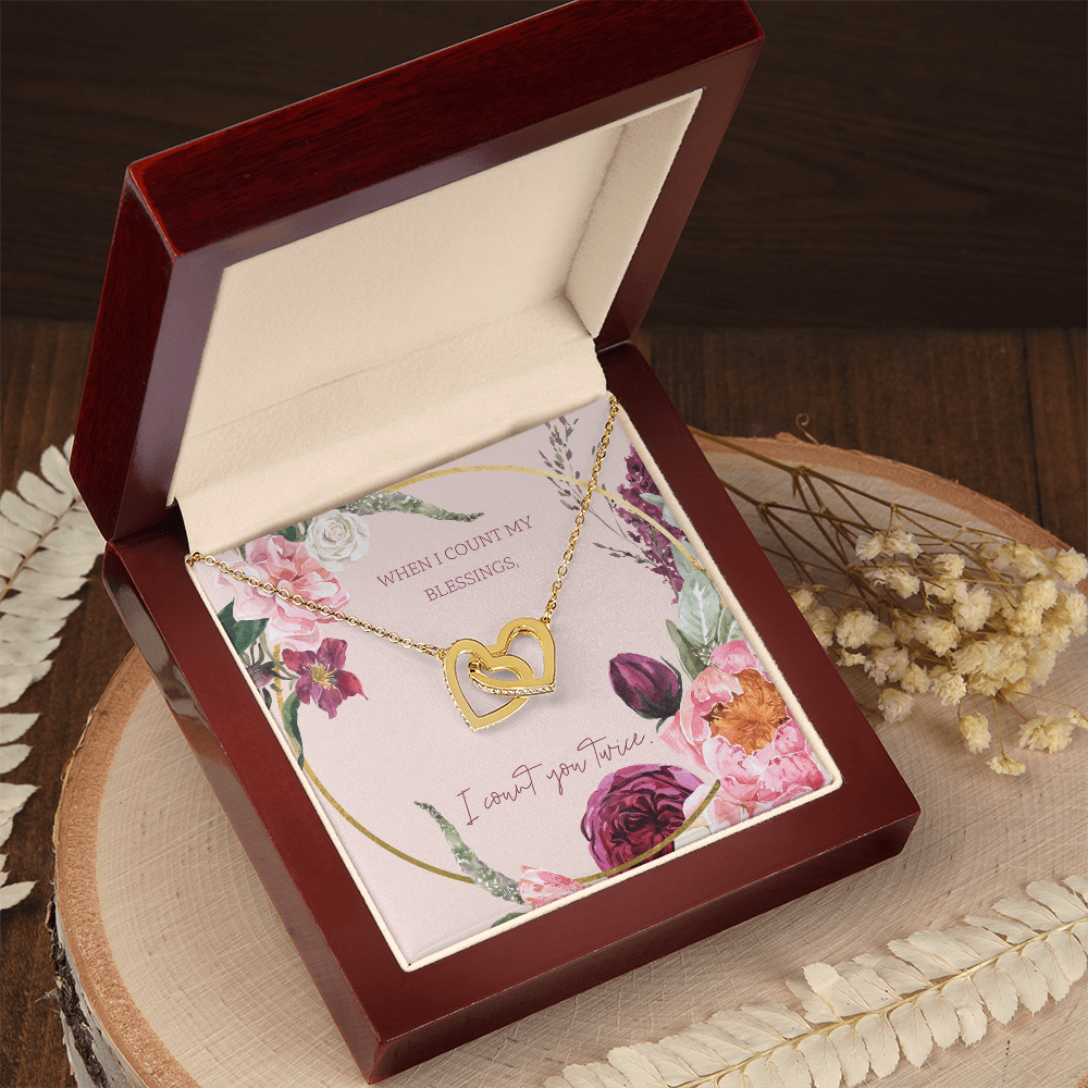 Heart pendant necklace with linked chain in a floral gift box