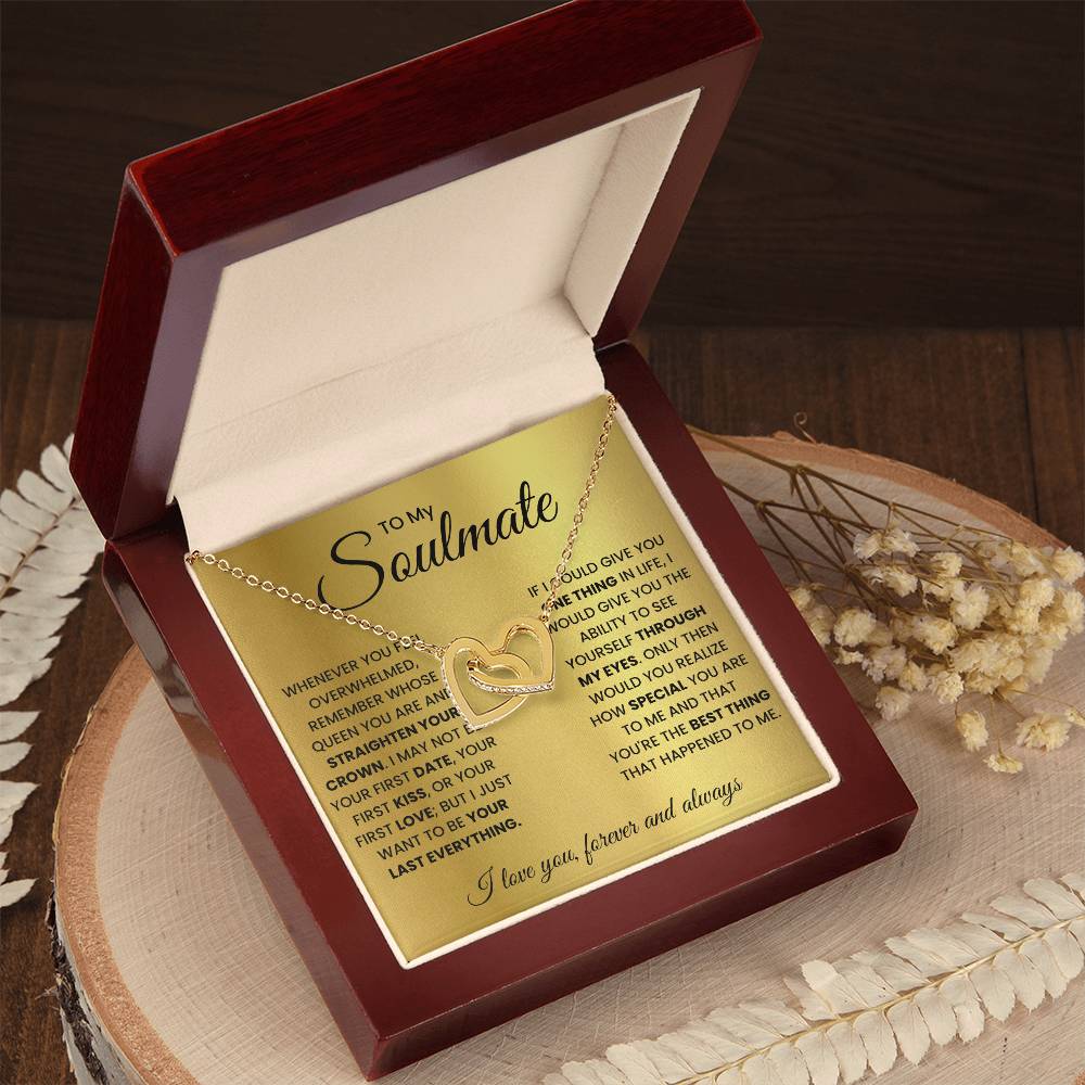 Heart pendant necklace in an open red gift box with gold-tone heart charm
