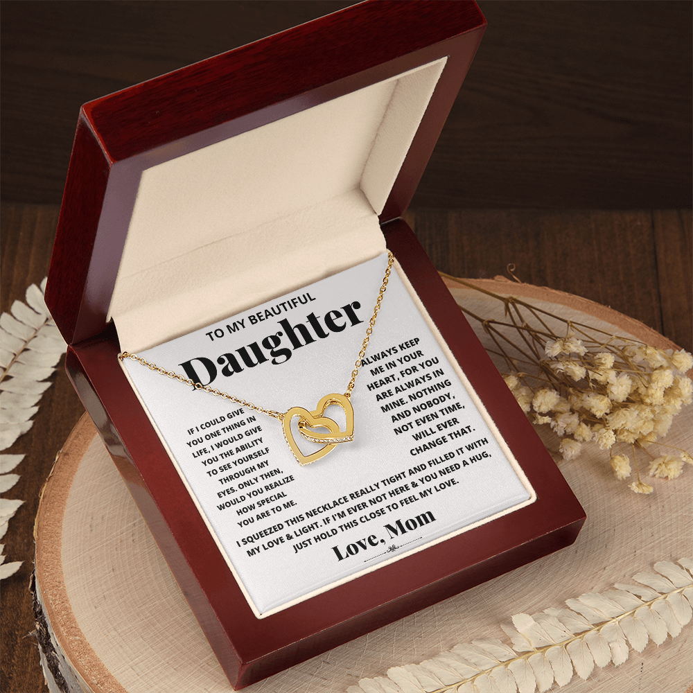 Daughter heart necklace with gold-tone chain and heart pendant in an open gift box.