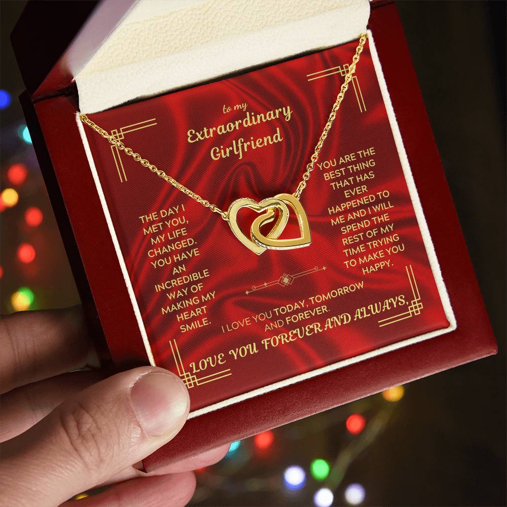 Gold-tone heart pendant necklace on a thin chain shown inside a gift box