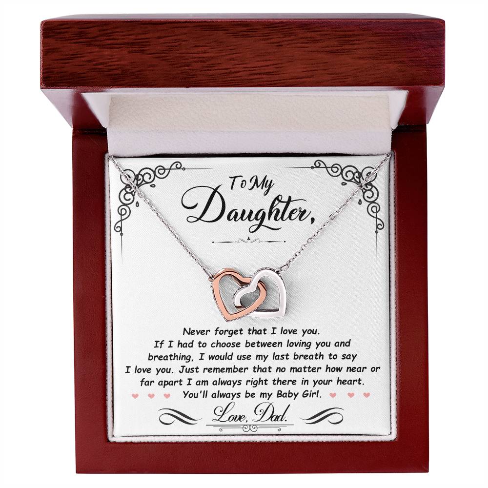 Silver-tone heart pendant necklace with two-tone heart charm in a red gift box