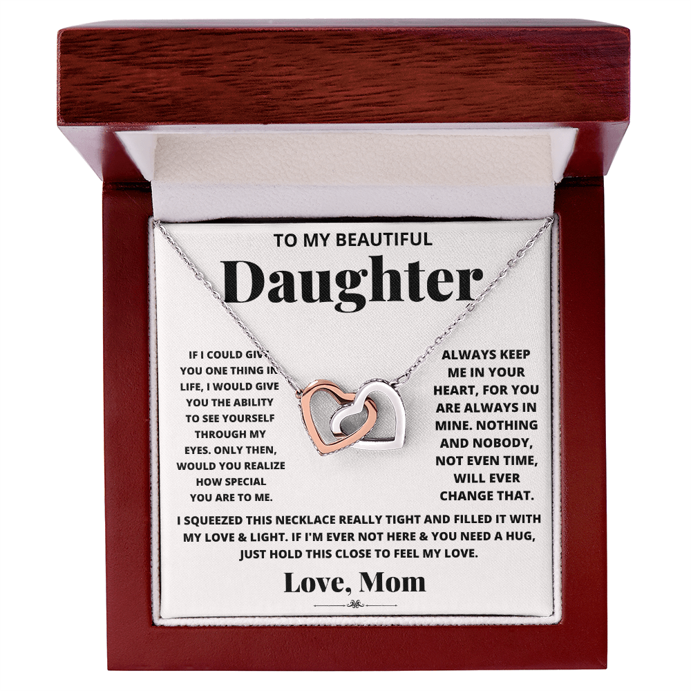 Daughter heart necklace in silver-tone with heart pendant in a red gift box.