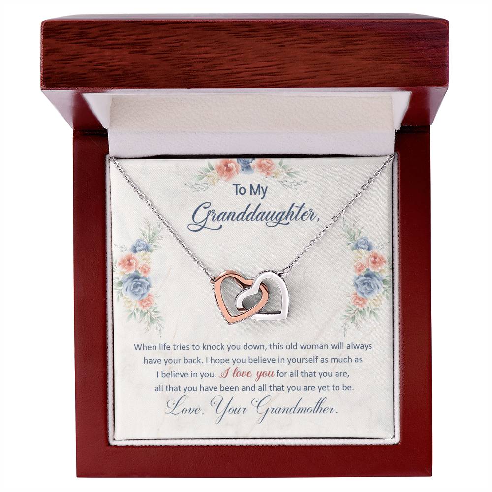 Silver heart pendant necklace shown inside a red floral gift box with note